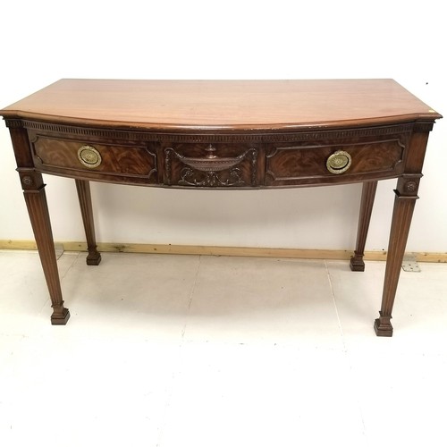 205 - 2 drawer mahogany bow fronted side table with carved urn detail to centre, 136 cm wide, 68 cm deep, ... 