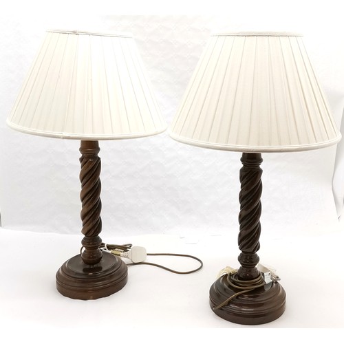 218 - Pair of barley twist turned wooden lamps with shades, 70 cm high, 40 cm diameter shade.