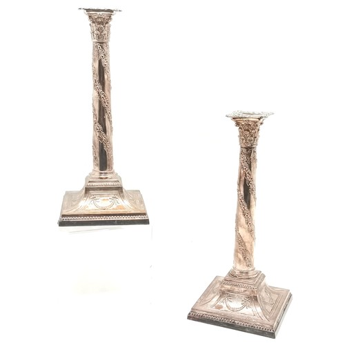 230 - Pair of Adam's style Corinthian column candlesticks, showing copper, 35 cm high, 15 cm diameter base... 