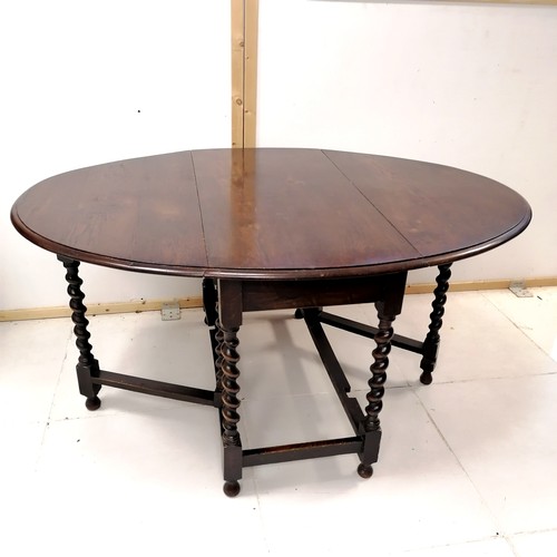 244 - 1930's oak drop flap gateleg table with barley twist supports, 106 cm wide, 147 cm length to include... 