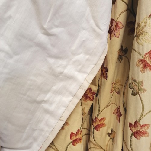 247 - Pair of cream floral lined curtains 240cm long x 300cm wide - some fading