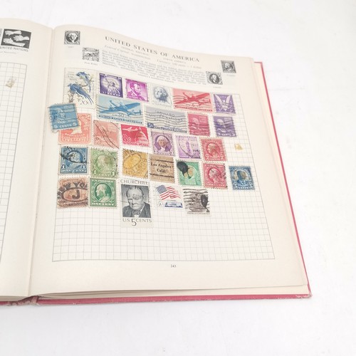 256 - SG International stamp album packed with stamps t/w Strand stamp album (virtually empty)