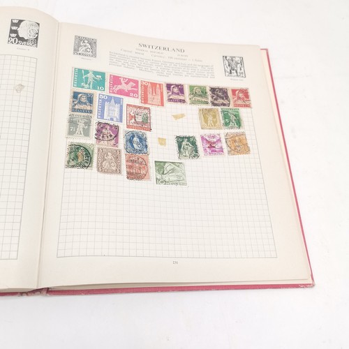 256 - SG International stamp album packed with stamps t/w Strand stamp album (virtually empty)