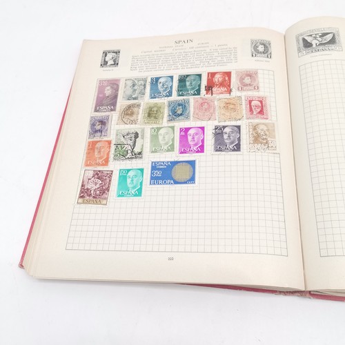 256 - SG International stamp album packed with stamps t/w Strand stamp album (virtually empty)