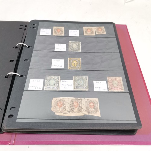 257 - Useful Russia collection of stamps in 2 albums + sheets ~ the red album has hagner sheets covering e... 