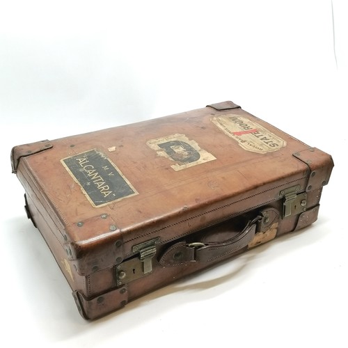 274 - Antique tan leather suitcase by George Perry (Dublin) with travel labels - 54cm x 34cm x 16cm