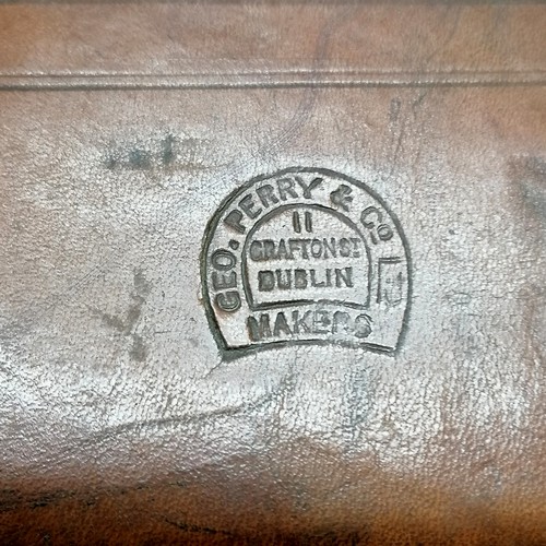 274 - Antique tan leather suitcase by George Perry (Dublin) with travel labels - 54cm x 34cm x 16cm