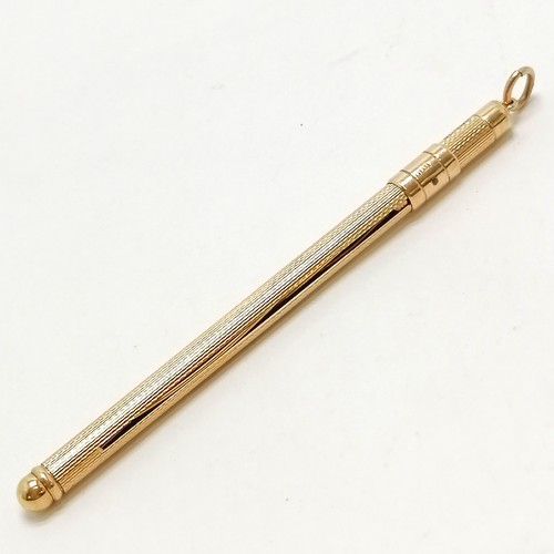 314 - 9ct marked gold swizzle stick - 13cm extended & 6.7g total weight