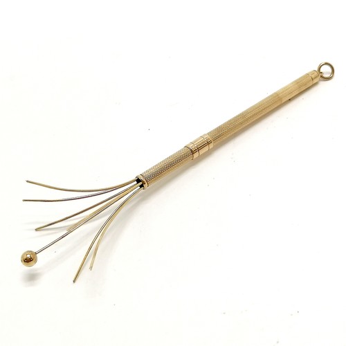 314 - 9ct marked gold swizzle stick - 13cm extended & 6.7g total weight