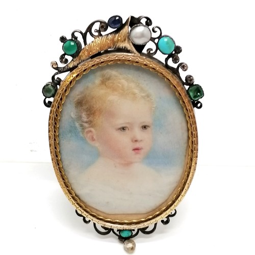 315 - Antique portrait miniature of a child in a gilt metal frame with locket reverse and with cornucopia ... 