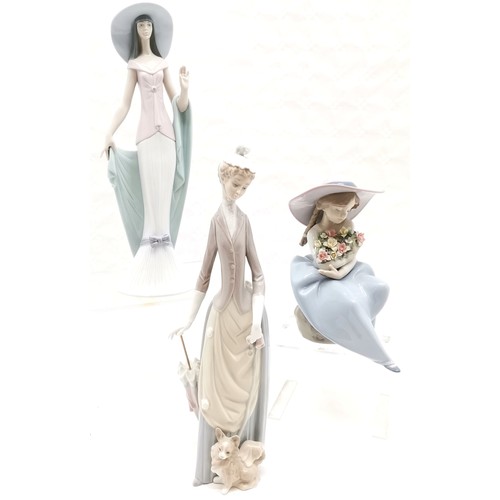 399 - Lladro Lady with parasol and dog, 36cm high, 1920's style 'Lady of Nice' 35cm high, t/w seated lady ... 