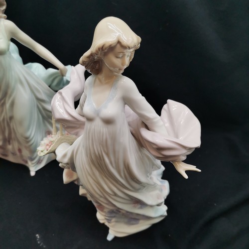 400 - Lladro lady with bird to shawl, 32 cm high, t/w similar holding basket of flowers with firing fault ... 