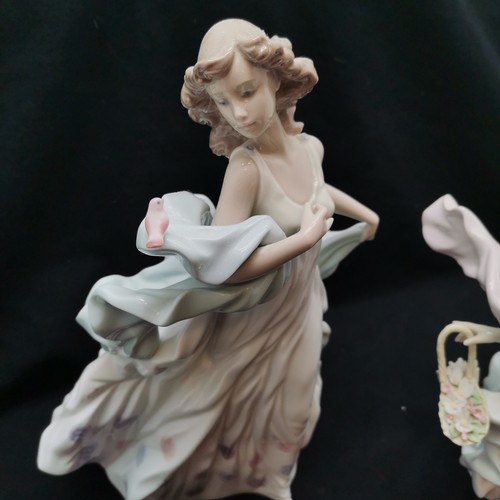 400 - Lladro lady with bird to shawl, 32 cm high, t/w similar holding basket of flowers with firing fault ... 