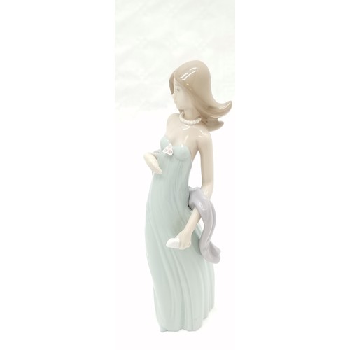 404 - Lladro figure of a boy with puppy, 21.5 cm high, Girl with parasol & dove, 23 cm high, seated lady f... 