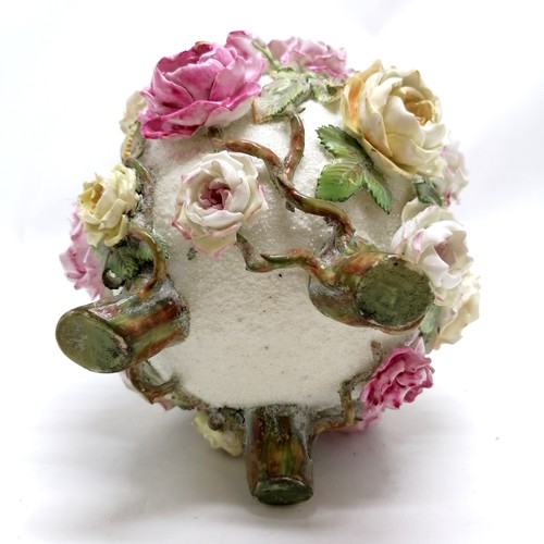 438 - Antique heavily encrusted floral / rose vase on 3 feet - 21cm high ~ slight losses but overall in go... 