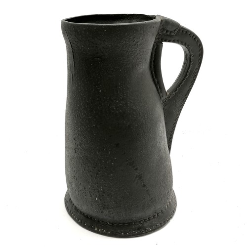 440 - Antique leather flagon / blackjack - 24cm high