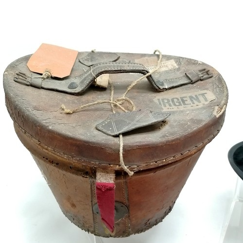 454 - Antique leather cased moleskin top hat (inside 20cm x 15.5cm) - has obvious wear to hat and case t/w... 