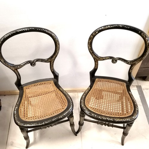 467 - Pair of Victorian ebonised and mother of pearl inlaid balloon back bedroom chairs, with cane seating... 