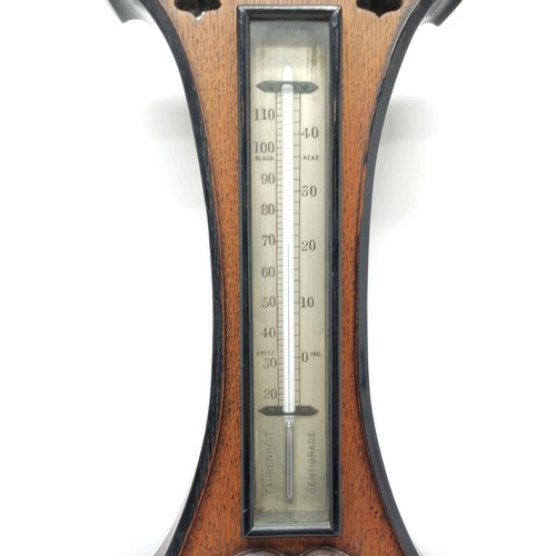 133 - James Lucking & Co (Birmingham) Art Nouveau oak barometer / thermometer with ebonised deep carved de... 