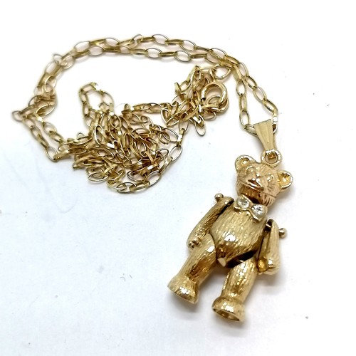 848 - 9ct hallmarked gold articulated bear pendant with white stone set bow on a 9ct marked gold 40cm chai... 