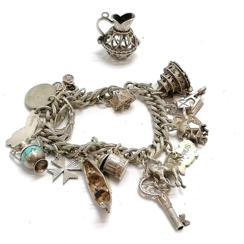 851 - Unmarked bracelet with mostly silver charms inc Maltese silver t/w jug pendant - 74g total weight