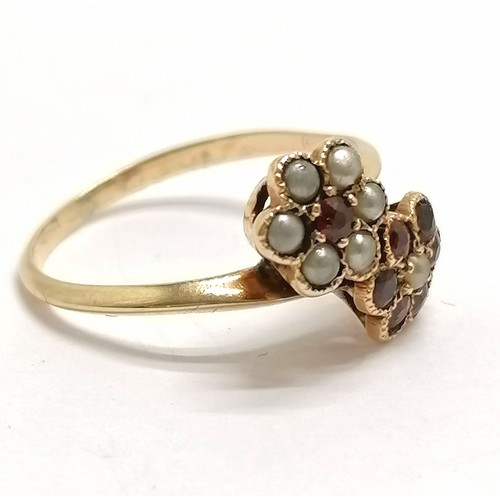 855 - Antique unmarked gold garnet & seed pearl double cluster crossover ring - size L½ & 2g total weight