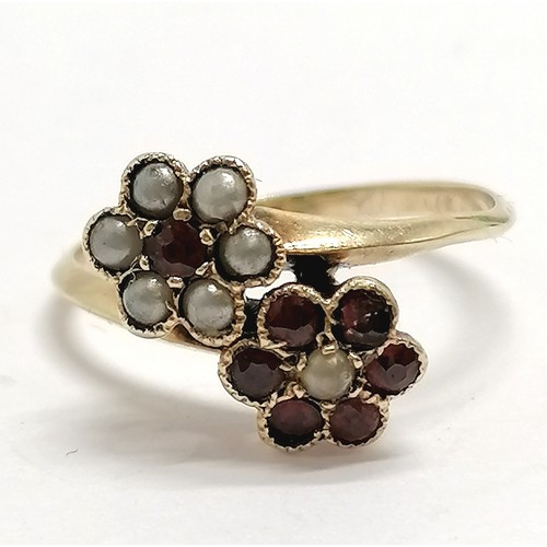 855 - Antique unmarked gold garnet & seed pearl double cluster crossover ring - size L½ & 2g total weight