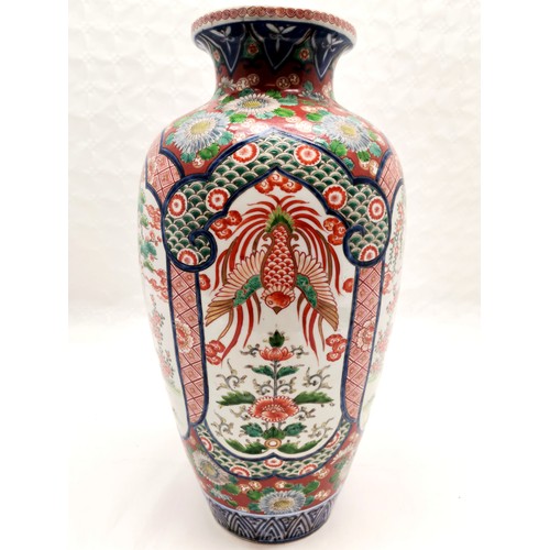 143 - Oriental profuse decorated vase with 4 panels - 43cm high ~ has old repair to rim (with bat decorati... 