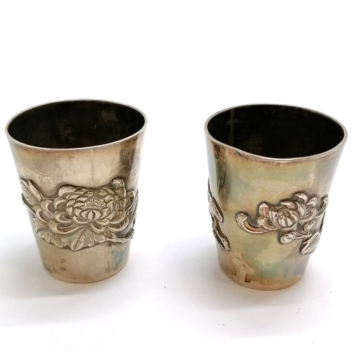 161 - Pair of Oriental Chinese 900 silver beakers with floral detail by WK - 5.5cm high & 101g total weigh... 