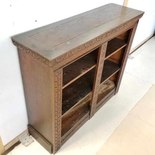 182 - Antique oak carved decorated bookcase, fitted with 2 adjustable shelves, 108 cm wide, 32 cm deep, 90... 