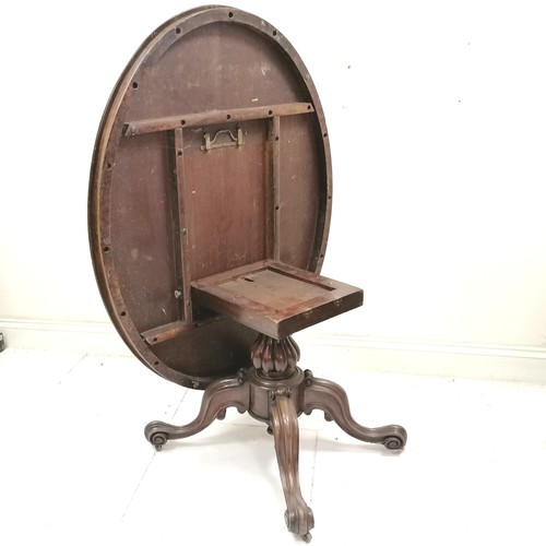 183 - Victorian walnut oval tilt top centre table, on carved centre pedestal, carved cabriole legs with ce... 