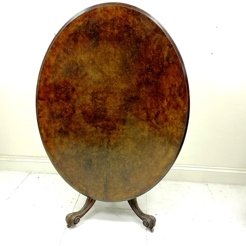 183 - Victorian walnut oval tilt top centre table, on carved centre pedestal, carved cabriole legs with ce... 