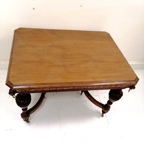 187 - Antique French oak centre table with carved lion mask handles to the corners, with shaped and turned... 