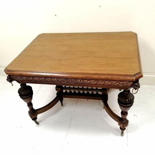 187 - Antique French oak centre table with carved lion mask handles to the corners, with shaped and turned... 