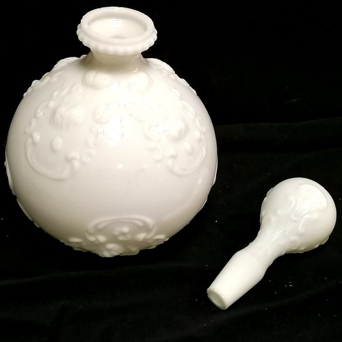 220 - Pair of milk glass decanters, with all over embossed decoration, 25 cm high, slight rim chips, t/w c... 