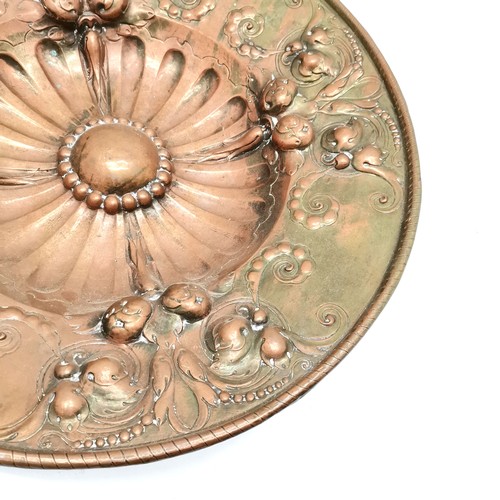 221 - Antique continental large copper charger, with all over floral and fruit decoration. 53 cm diameter,... 