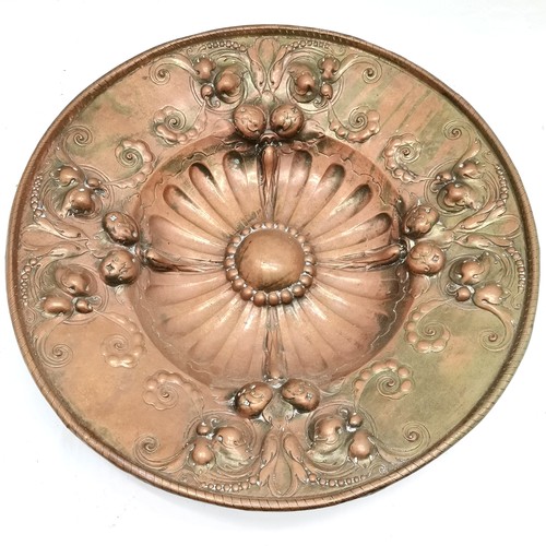 221 - Antique continental large copper charger, with all over floral and fruit decoration. 53 cm diameter,... 