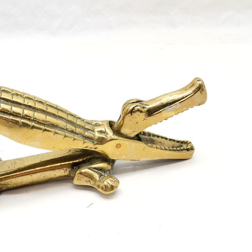 228 - Vintage novelty brass nutcracker in the form of a crocodile, 36 cm length, t/w pair of brass ladles ... 