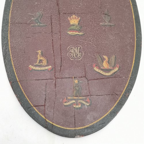 232 - 1862 Painted oval Armorial panel, painted with assorted crests, 34 cm high, 21 cm wide.