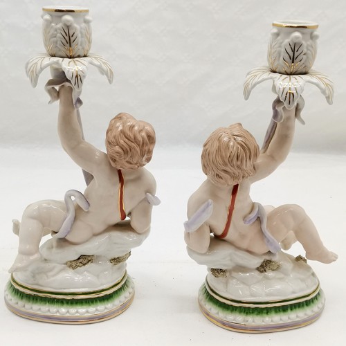 278 - Pair of Continental Putti candlesticks, 31 cm high, 18 cm wide. in good used condition.