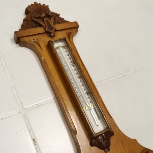 295 - A W Gamage Ltd London, Oak cased, banjo shaped Aneroid barometer, with thermometer, with carved deco... 