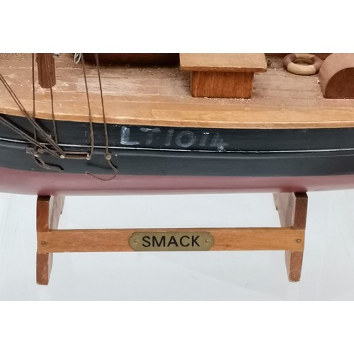 316 - 2 Scratch built wooden model sailboats. 61cm high. name plate smack. Has one sail detached but prese... 