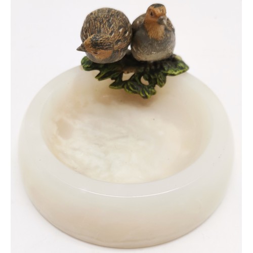 323 - Pair of coldpainted bronze partridge bird figures on a circular polished alabaster pin/coin dish mea... 