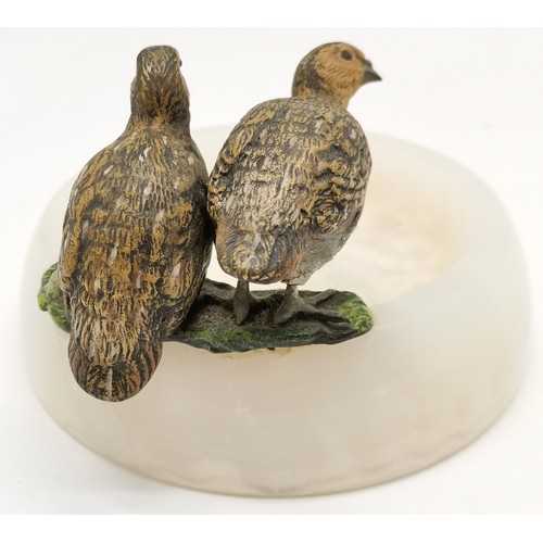 323 - Pair of coldpainted bronze partridge bird figures on a circular polished alabaster pin/coin dish mea... 