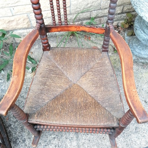 349 - Antique Arts & Crafts (Libertys?) rush seated rocking chair with bobbin turnings - 115cm high x 57cm... 