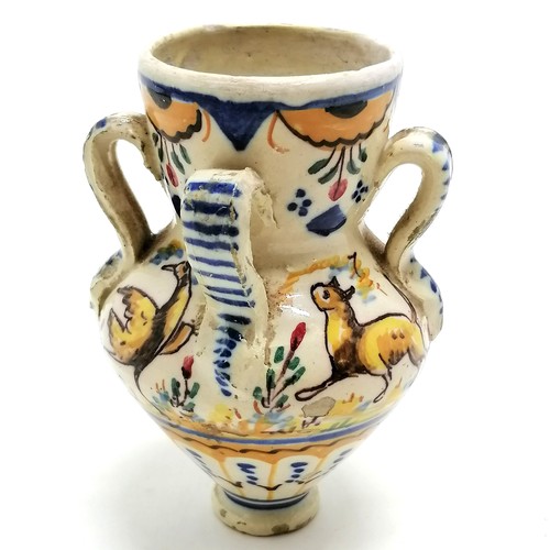 364 - Maiolica pot with 4 tag handles & animal detail - 13cm high and has slight hairline but no obvious d... 