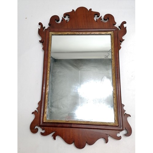 365 - Antique mahogany fret carved mirror with gilded slip - 57cm x 36cm and has slight losses t/w easel s... 