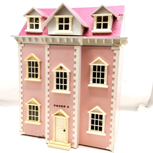 489 - Pink painted dolls house to include a selection of assorted furniture and furnishings, 50 cm wide, 6... 