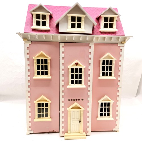 489 - Pink painted dolls house to include a selection of assorted furniture and furnishings, 50 cm wide, 6... 