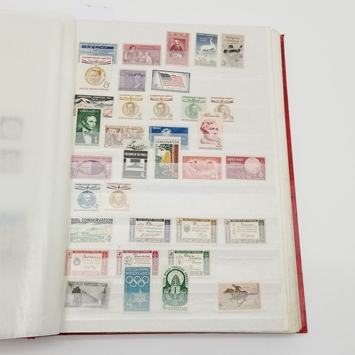 496 - Red stockbook with qty of mostly mint USA t/w Christmas stamps, Hawaii, booklets (some evidence of d... 